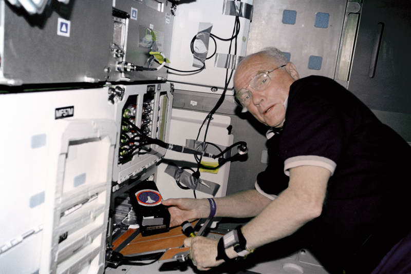 STS-95 payload specialist John Glenn in a locker in the Discovery’s middeck. (Image: NASA/JPL)